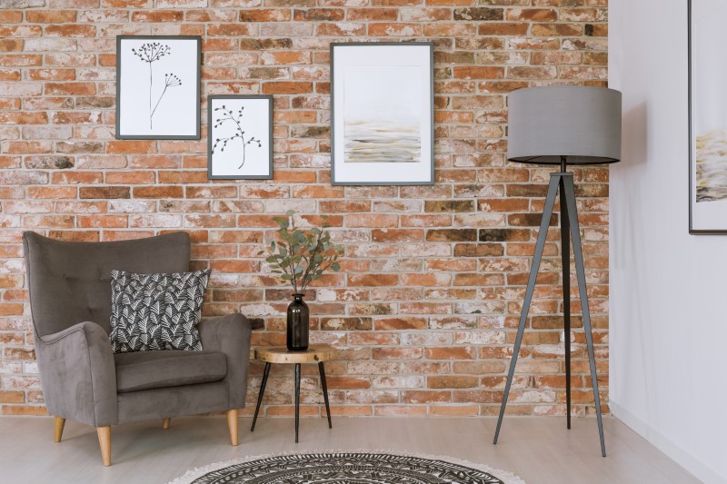 gray-furniture-against-brick-wall-PL8N9BY.jpg